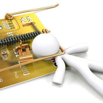A man caught in a mouse trap made out of a credit card. Created to illustrate predatory lending and credit dangers.