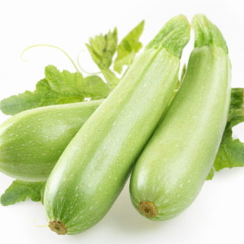 Ripe squash with leaves on white background